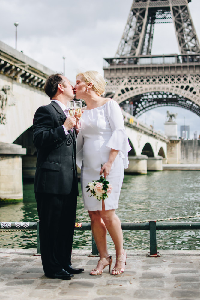 Romantic scenes in front of the Seine River for a couples engagement shoot