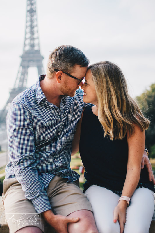 Romantic Eiffel tower maternity announcement photo shoot in Paris, France by New Zealand Photographer. 